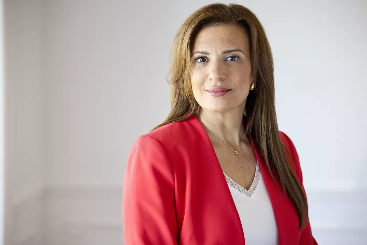 Marie-Dominique Taillon — portrait in a red blazer